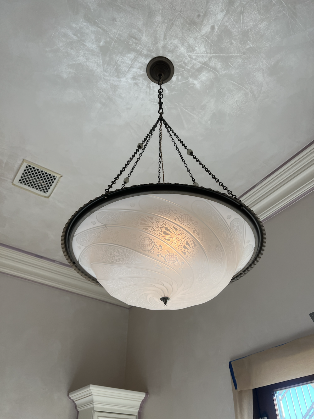 Paradise Valley custom chandelier beneath a decorative ceiling