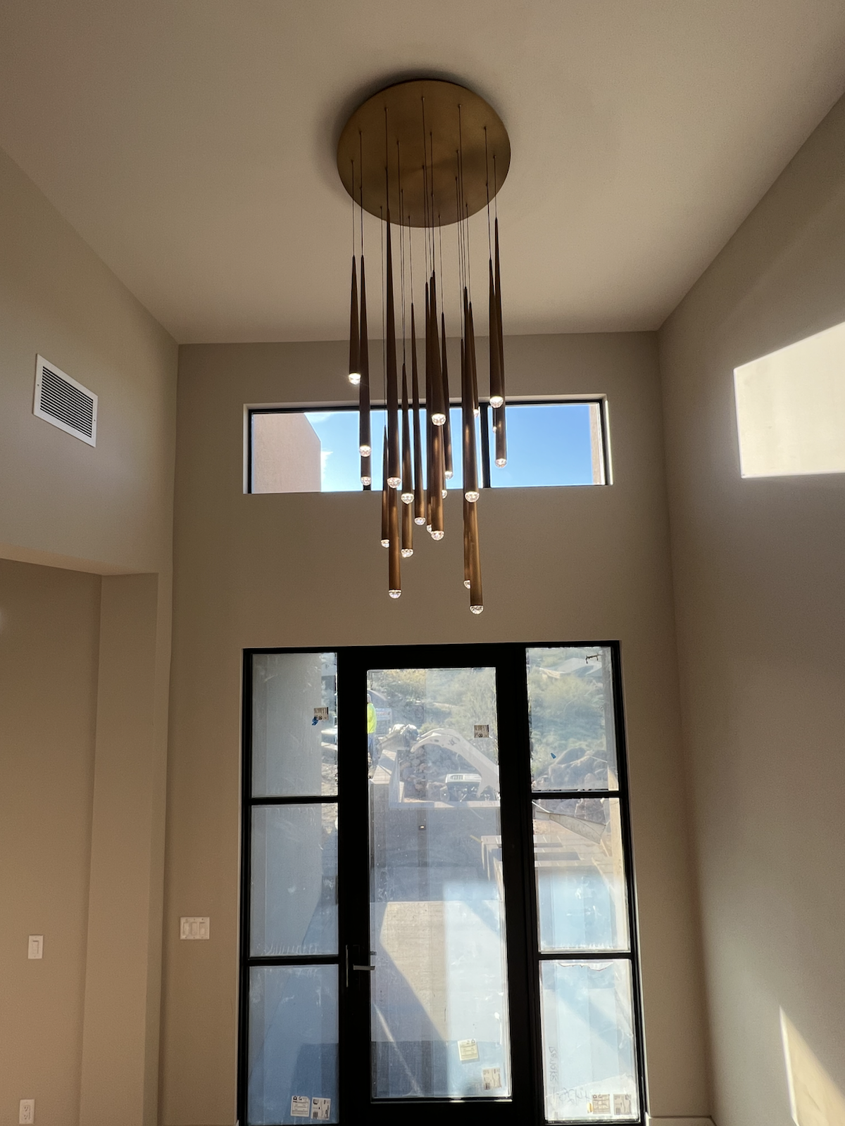 Custom chandelier over a foyer entry